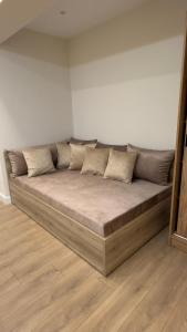 a large couch sitting in a room at Sweet Nest in Paralia Katerinis
