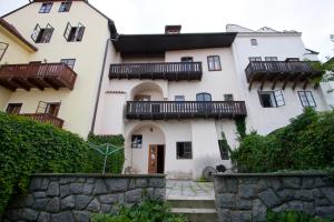 a large white building with balconies on top of it at Apartma Star by Jary in Český Krumlov