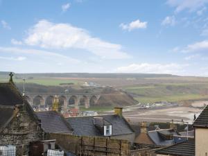 a view of a town with houses and a bridge at Brae Lodge in Cullen