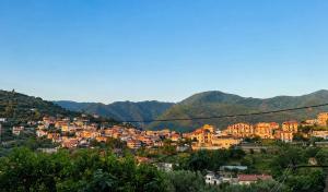 a view of a city with mountains in the background at B&B Venere Rooms in Pimonte +10 photos