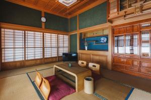a room with a desk and a chair in it at Irest Village Narita in Narita