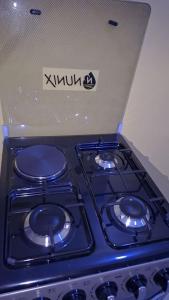 a stove top with a box on top of it at BREE'S EXECUTIVE STAYs in Kakamega