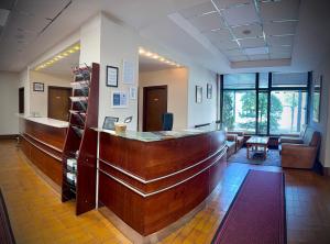 a lobby with a reception desk and a waiting room at Hotel Kutina in Kutina