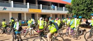 a group of people in yellow vests on their bikes at WYCE Gambia Lodge in Dau Dula
