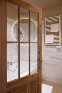 a glass door in a bathroom with a shower at La Sauternaise, luxury Boutique B&B in Sauternes +103 photos