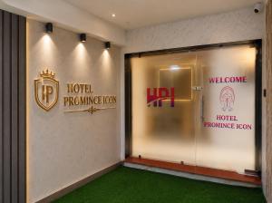 a room with a door and signs on the wall at Hotel Promince Icon in Ahmedabad