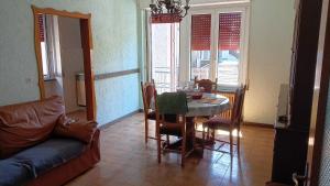a living room with a table and a couch at B&B GabriEle in Molina di Ledro +22 photos