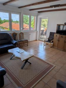 a living room with a couch and a coffee table at Adlerhorst in Bruchhausen-Vilsen