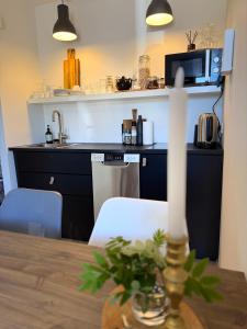 a kitchen with a table and a counter top at Granastaðir Guesthouse in Granastaðir