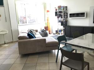 a living room with a couch and a table at My house in Turin