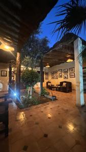 a light shines in a patio at night at Oloft in Marrakesh