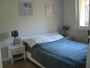 Postel nebo postele na pokoji v ubytování Blue Mare Apartament u Kwiatków