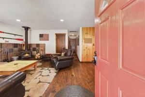 a living room with a couch and a table at The Rustic Pine 2BDR Cabin in Tahoma