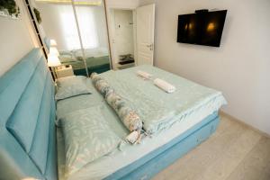 a hospital bed in a room with a tv at Apartmani SLEEP&JOY in Zlatibor +86 photos
