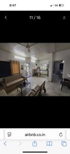 a picture of a living room with a couch at Dalipfarm River View Guestroom in Surajpur