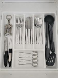 a white drawer filled with utensils at Wake&wave in Užpelkiai