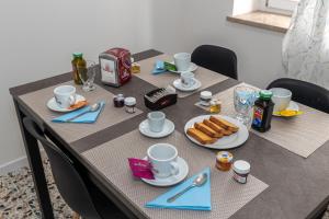 a table with plates of food on top of it at Il Nido Dei Ribelli in Mergo +29 photos