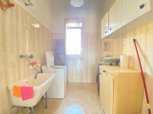 a bathroom with a sink and a toilet in it at Salento mare in Casalabate +5 photos