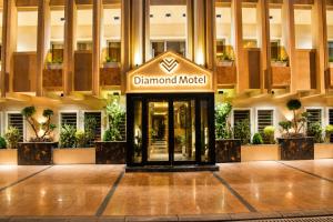 a sign for the diamond hotel in the middle of a building at Diamond Motel in Baghdād