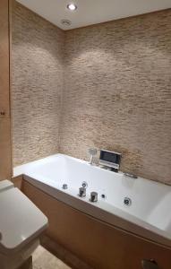 a bath tub with a laptop on top of it at Appartement l'Ariondaz in Courchevel