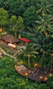 an overhead view of a building with palm trees at The Beauty Riptide in Karangasem