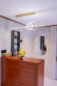 a chandelier hanging over a counter in a room at The Beauty Riptide in Karangasem