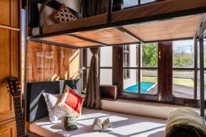 a room with a bunk bed and a large window at RWACHO Hostel The Base in Leh +114 photos