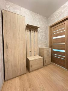 a room with wooden cabinets and a closet at квартира in Odesa