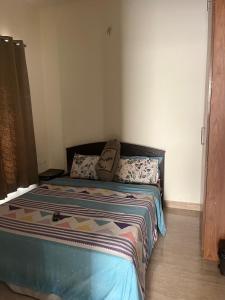 a bedroom with a bed in a room at Sai VVR homestay in Chennai