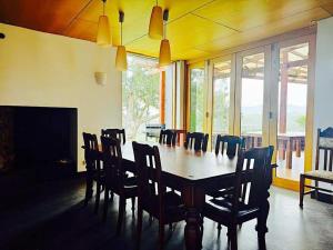 a dining room with a table and chairs at Wandin Farm Views in Wandin North +12 photos