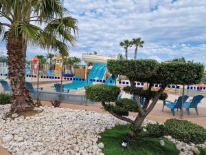 a view of a water park with a playground at Valras Jasmin 68 in Sérignan