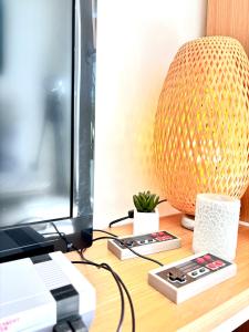a desk with a computer and a lamp on it at Cozy Vallevò in Rocca San Giovanni
