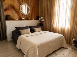 a bedroom with a large bed and a mirror at BARREAU in Libourne +49 photos