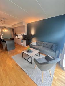 a living room with a couch and a table at City apartment in Alta
