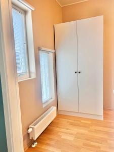 a room with a white cabinet and a window at City apartment in Alta +11 photos
