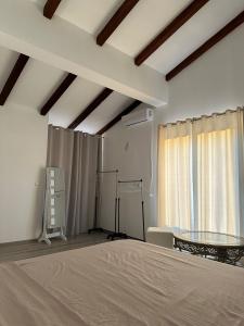 a bedroom with a bed and a glass table at Kelesina Apartment in Ulcinj +14 photos
