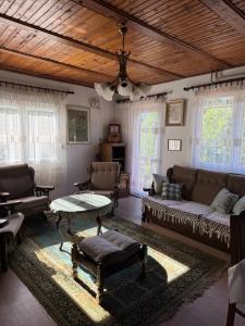 a living room with a couch and a table at Vikendica Jazina in Lastva