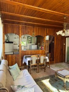 a living room with a couch and a table at Vikendica Jazina in Lastva