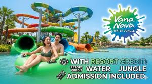 a man and woman riding on a water slide at a water park at Blue Horizon in Hua Hin