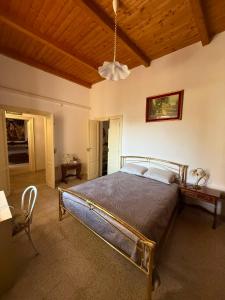 a bedroom with a bed and a wooden ceiling at Casa Bella Tania in Briatico