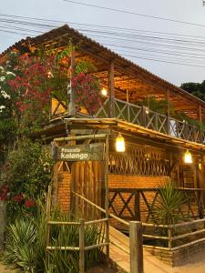 a building with flowers on the front of it at Pousada Kalangoo in Barra Grande