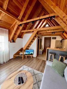 a living room with a couch and a table at Underwoods_chill in Žabljak