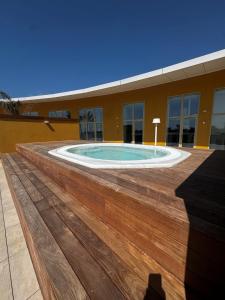 a building with a swimming pool in front of a building at Le VIBES RESORT By AGN "réservé aux couples" in Cap d'Agde