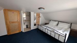 a bedroom with a bed and a bathroom at 7Rooms in Telnice +13 photos