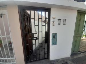 an entrance to a building with a revolving door at Hospedaje Maljut in Lima