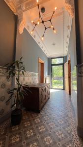 a large hallway with a tub and a potted plant at Le Clos Boréal - Gîte Spa Privatif in Lens