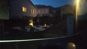a view of a yard at night at Casa Copacabana in Oya