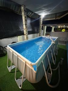 a large pool of water in a room at Homestay D Makmur UNIT 1 in Mersing
