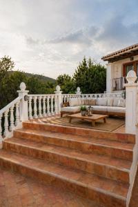 a set of stairs with a couch on a house at Excelente villa With pool ibiza in Santa Gertrudis de Fruitera