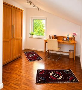 a home office with a desk and a chair at Quiet & Friendly Bremen in Bremen